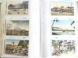 an open book with pictures of a city and a bridge in it