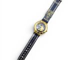 a close up of a watch on a white surface