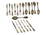 a lot of forks and spoons that are on the table
