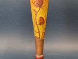 a vase that is sitting on a stand on a blue background