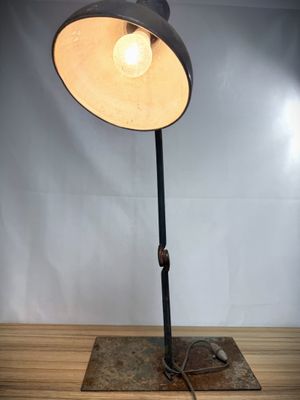an image of a lamp that is on top of a wooden table
