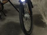 a bicycle with a basket on the back of it