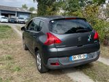 a black car parked on the side of the road