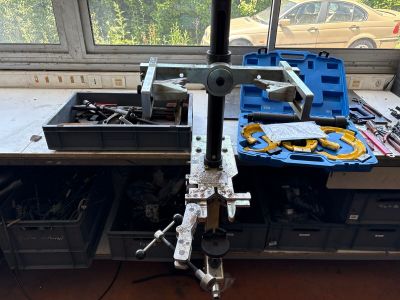 a picture of a workbench with tools on it in front of a window