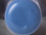 a close up view of a blue plastic object in a sink