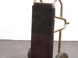 a small hand truck with a luggage bag on it