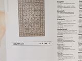 a picture of a book with a picture of a rug on it