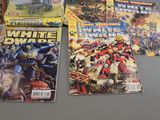 a lot of comic books sitting on a table