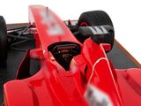 a close up of a red race car on display