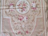 a picture of a pink and white rug with pink flowers on it
