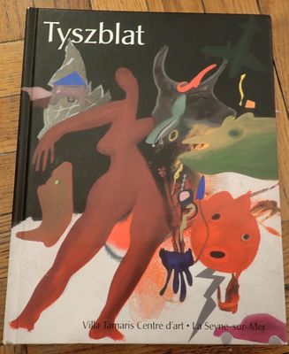 a book with a picture of a woman and a cat