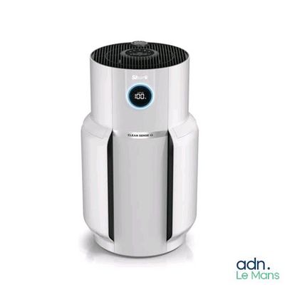 a white air purifier sitting on top of a white table