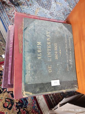 several books are stacked on top of each other on a table