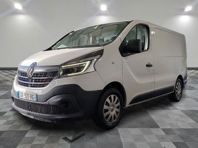 the white van is parked on a checkered floor in a room