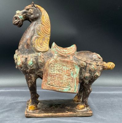 statue of a horse with a saddle on it ' s back