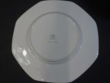 a white plate with a green design on it