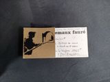 a business card with a picture of a man on a motorcycle