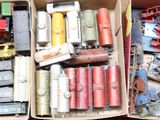 a box full of assorted toy train parts