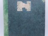 a green book with a picture of a dog on it