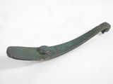 an old metal handle on a white surface with snow in the background