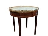 une image d'une petite table avec un plateau en marbre