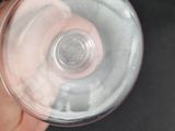 a person holding a glass of water in their hand