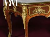 a table with a marble top on a red background