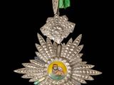 une image représentant une médaille d'argent sur laquelle figure le portrait d'une femme