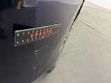 a close up of a car ' s emblem on the side of the car