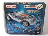 lego technic mechanical car set in a tin box on a white surface