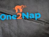 a black bag with a blue one 2 nap logo on it
