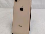 an apple iphone sitting on top of a stand on a white surface