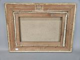 an old picture frame with a picture of a man on it