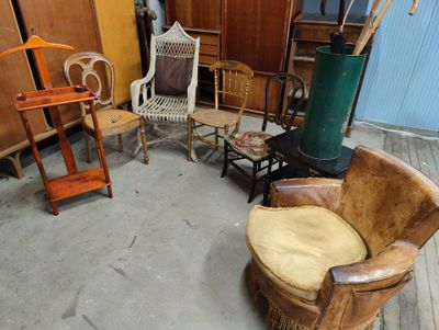 a room with a lot of chairs and a table