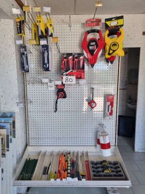 many tools hanging on a pegboard in a garage