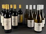 several bottles of wine are lined up on a table