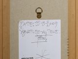 an image of a picture of a piece of art with a note attached to it