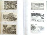 a book opened to show pictures of a city