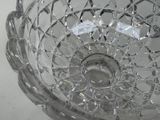 a glass bowl that has a broken glass inside of it