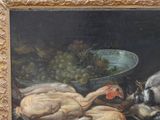 a picture of a painting of a cat and a bird on a table