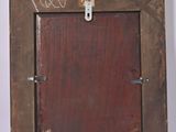 a picture of a wooden picture frame on the wall