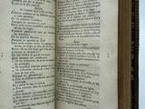 an open book on a table with a white background
