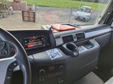 a car dashboard with a steering wheel and dashboard controls