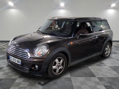 a picture of a black mini cooper parked in a garage