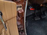 dashboard of a car with the door open and the door handle open
