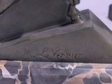 statue of a horse on a marble base on a white surface