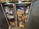 a refrigerator that has a lot of boxes inside of it