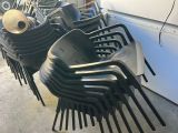 a lot of chairs that are stacked on top of each other