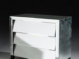 mirrored chest of drawers with three drawers on each side of it