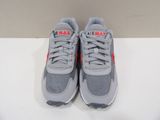 the nike air max is a grey and red shoe with a white sole